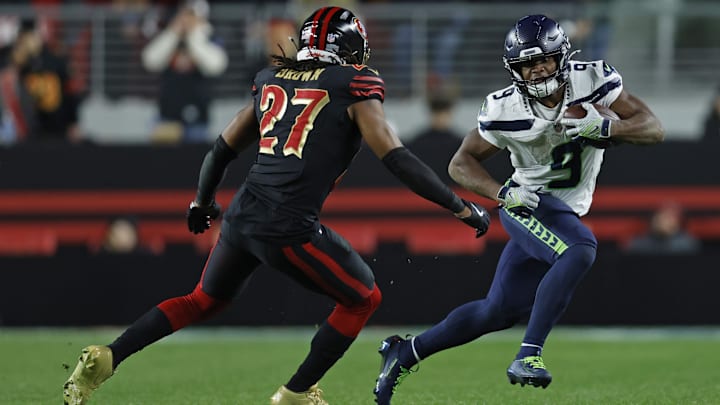 Jan 3, 2026; Santa Clara, California, USA; Seattle Seahawks running back Kenneth Walker III (9) rushes the ball against San Francisco 49ers safety Ji'ayir Brown (27) during the second half at Levi's Stadium. Mandatory Credit: Sergio Estrada-Imagn Images