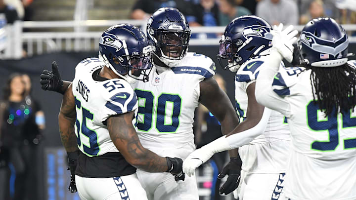 Sep 30, 2024; Detroit, Michigan, USA; Seattle Seahawks defensive tackle Jarran Reed (90) celebrates with teammates after recording a sack against the Detroit Lions in the first quarter at Ford Field. Mandatory Credit: Eamon Horwedel-Imagn Images Sep 30, 2024; Detroit, Michigan, USA; Seattle Seahawks defensive tackle Jarran Reed (90) celebrates with teammates after recording a sack against the Detroit Lions in the first quarter at Ford Field. Mandatory Credit: Eamon Horwedel-Imagn Images