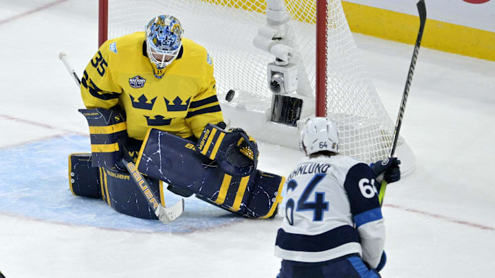 Feb 15, 2025; Montreal, Quebec, CAN; [Imagn Images direct customers only] Team Finland forward Mikael Granlund (64) scores the winning goal against Team Sweden goalie Linus Ullmark (35) in the overtime period during a 4 Nations Face-Off ice hockey game at the Bell Centre. Mandatory Credit: Eric Bolte-Imagn Images