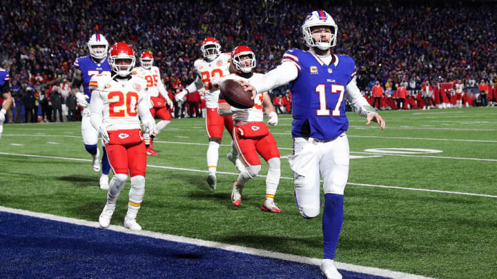 Buffalo Bills quarterback Josh Allen (17) scores a first half touchdown against the Chiefs .