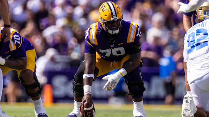 Sep 21, 2024; Baton Rouge, Louisiana, USA; LSU Tigers offensive lineman DJ Chester (79) waits to snap the ball against UCLA Bruins defensive lineman Siale Taupaki (92) during the first half at Tiger Stadium. Mandatory Credit: Stephen Lew-Imagn Images Sep 21, 2024; Baton Rouge, Louisiana, USA; LSU Tigers offensive lineman DJ Chester (79) waits to snap the ball against UCLA Bruins defensive lineman Siale Taupaki (92) during the first half at Tiger Stadium. Mandatory Credit: Stephen Lew-Imagn Images