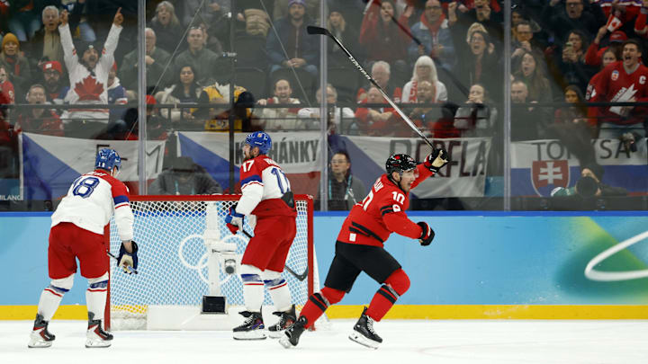 Feb 18, 2026; Milan, Italy; Nick Suzuki of Canada celebrates after scoring their third goal against Czechia in a men's ice hockey quarterfinal during the Milano Cortina 2026 Olympic Winter Games at Milano Santagiulia Ice Hockey Arena. Mandatory Credit: Geoff Burke-Imagn Images