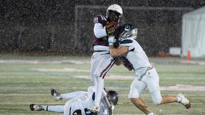 Nov 22, 2024; Ramsey, NJ, USA; St. Augustine Prep at Don Bosco Prep in the NJSIAA Non-Public A football semifinals. SA #8 Julian Turney tries to avoid a tackle by SA #3 Danny Francis.