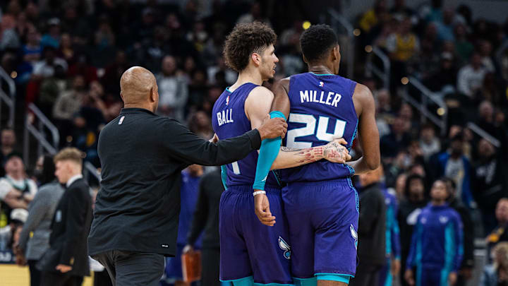 Nov 4, 2023; Indianapolis, Indiana, USA; Charlotte Hornets guard LaMelo Ball (1) pulls forward Brandon Miller (24)  away from the crowd in the second half against the Indiana Pacers at Gainbridge Fieldhouse. Mandatory Credit: Trevor Ruszkowski-Imagn Images