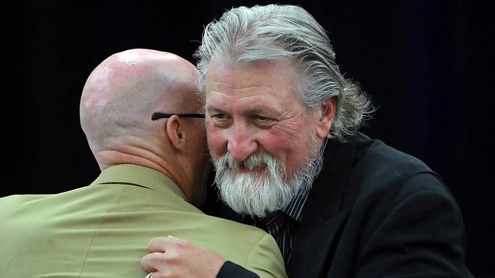 Former Zips basketball coach Bob Huggins, facing, hugs current coach John Groce after speaking during the Akron Basketball reunion and celebration at the University of Akron student union, Saturday, July 27, 2024, in Akron, Ohio.