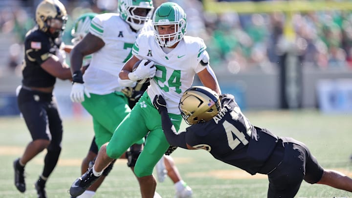 Sep 20, 2025; West Point, New York, USA; North Texas Mean Green running back Caleb Hawkins (24) runs for a touchdown against the Army Black Knights during the second half at Michie Stadium. Mandatory Credit: Danny Wild-Imagn Images