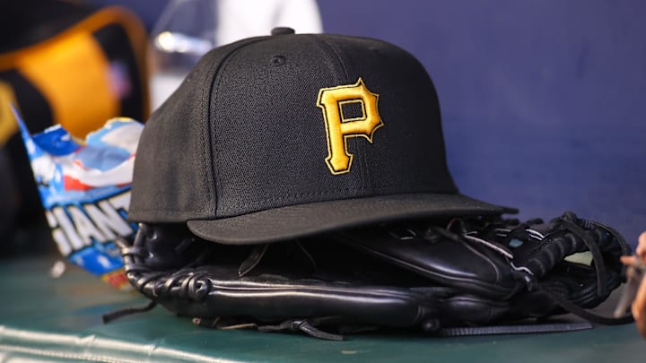 Sep 8, 2023; Atlanta, Georgia, USA; A detailed view of a Pittsburgh Pirates hat and glove before a game against the Pittsburgh Pirates in the first inning at Truist Park. Mandatory Credit: Brett Davis-Imagn Images