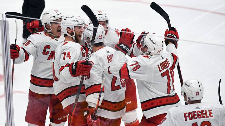 May 27, 2021; Nashville, Tennessee, USA; Carolina Hurricanes players celebrate after the game-winning goal by center Sebastian Aho (20) in overtime to eliminate the Nashville Predators in game six of the first round of the 2021 Stanley Cup Playoffs at Bridgestone Arena. Mandatory Credit: Christopher Hanewinckel-USA TODAY Sports May 27, 2021; Nashville, Tennessee, USA; Carolina Hurricanes players celebrate after the game-winning goal by center Sebastian Aho (20) in overtime to eliminate the Nashville Predators in game six of the first round of the 2021 Stanley Cup Playoffs at Bridgestone Arena. Mandatory Credit: Christopher Hanewinckel-USA TODAY Sports