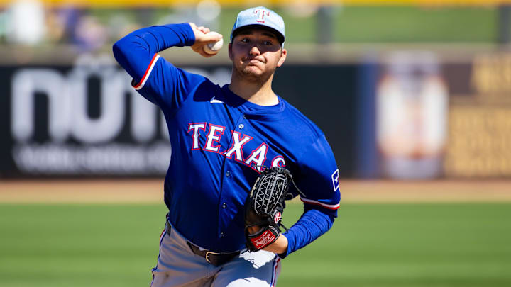 Mar 5, 2024; Peoria, Arizona, USA; Texas Rangers pitcher Owen White against the Seattle Mariners during a spring training baseball game at Peoria Sports Complex