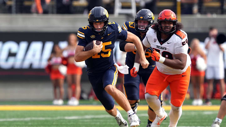 Cal quarterback Fernando Mendoza scrambles against Oregon State in 2024