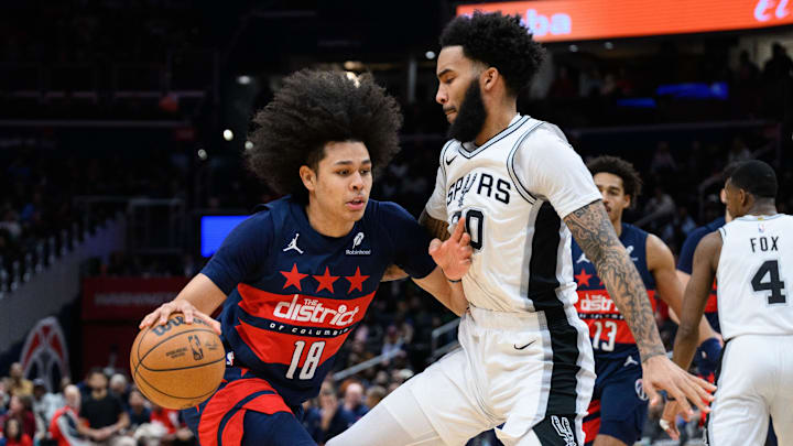 Feb 10, 2025; Washington, District of Columbia, USA; Washington Wizards forward Kyshawn George (18) drives to the basket against San Antonio Spurs forward Julian Champagnie (30) during the second quarter at Capital One Arena. Mandatory Credit: Reggie Hildred-Imagn Images Feb 10, 2025; Washington, District of Columbia, USA; Washington Wizards forward Kyshawn George (18) drives to the basket against San Antonio Spurs forward Julian Champagnie (30) during the second quarter at Capital One Arena. Mandatory Credit: Reggie Hildred-Imagn Images