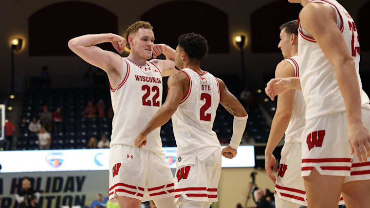 Nov 27, 2025; San Diego, CA, USA; Wisconsin Badgers guard Nick Boyd (2) reacts with Wisconsin Badgers forward Austin Rapp (22) after scoring against the Providence Friars during the second half at Jenny Craig Pavilion. Mandatory Credit: Abe Arredondo-Imagn Images