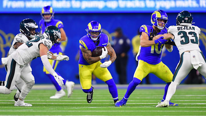 Nov 24, 2024; Inglewood, California, USA; Los Angeles Rams running back Blake Corum (22) runs the ball against the Philadelphia Eagles during the second half at SoFi Stadium. Mandatory Credit: Gary A. Vasquez-Imagn Images