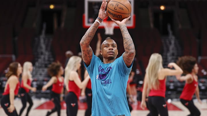 Guard Isaiah Thomas warms up before a 2022 NBA game with the Charlotte Hornets. 