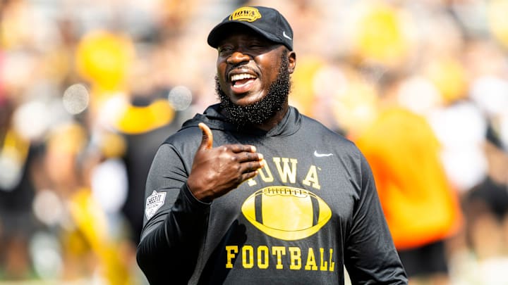 Aug 9, 2025; Iowa tight ends and fullbacks coach Abdul Hodge talks with players during the Hawkeyes Kids Day NCAA football open practice at Kinnick Stadium in Iowa City, Iowa. Mandatory Credit: Joseph Cress for the Des Moines Register