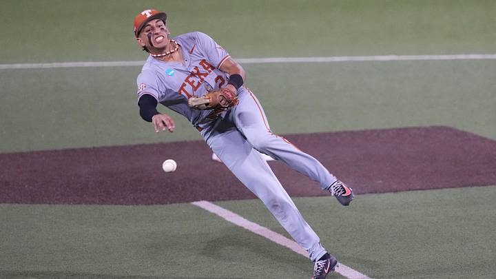 Texas Longhorns shortstop Adrian Rodriguez delivers a throw to first during the Austin Super Regional against the Oregon Ducks. Texas Longhorns shortstop Adrian Rodriguez delivers a throw to first during the Austin Super Regional against the Oregon Ducks.