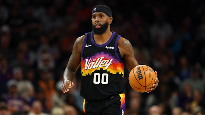 Feb 21, 2026; Phoenix, Arizona, USA; Phoenix Suns forward Royce O'Neale (00) against the Orlando Magic at Mortgage Matchup Center. Mandatory Credit: Mark J. Rebilas-Imagn Images