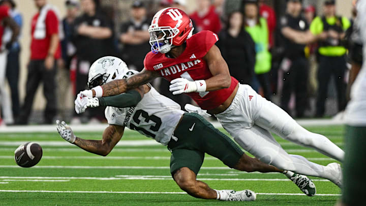 Oct 18, 2025; Bloomington, Indiana, USA; Indiana Hoosiers defensive back Amare Ferrell (1) breaks up a pass intended for Michigan State Spartans wide receiver Chrishon McCray (13) during the second half at Memorial Stadium. Oct 18, 2025; Bloomington, Indiana, USA; Indiana Hoosiers defensive back Amare Ferrell (1) breaks up a pass intended for Michigan State Spartans wide receiver Chrishon McCray (13) during the second half at Memorial Stadium.