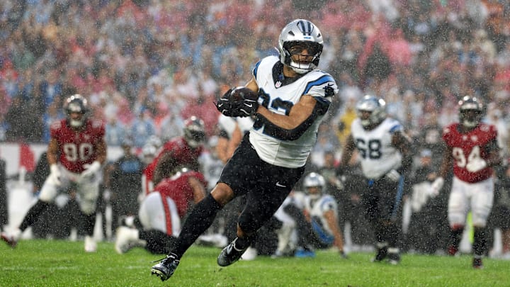 Jan 3, 2026; Tampa, Florida, USA; Carolina Panthers tight end Tommy Tremble (82) runs to score a touchdown against the Tampa Bay Buccaneers in the first half at Raymond James Stadium. Mandatory Credit: Nathan Ray Seebeck-Imagn Images