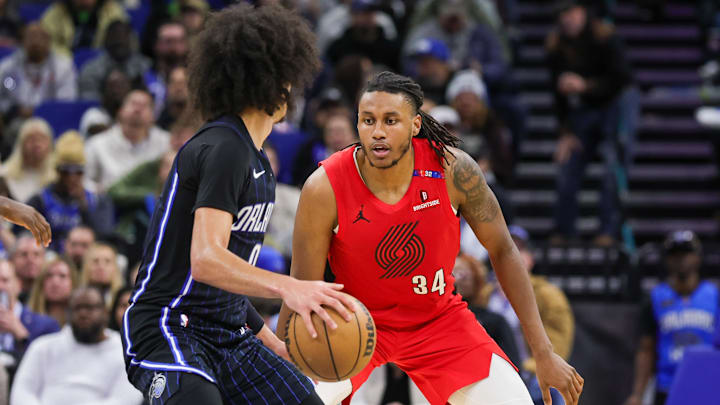 Jan 23, 2025; Orlando, Florida, USA; Portland Trail Blazers forward Jabari Walker (34) defends Orlando Magic guard Anthony Black (0) during the second half at Kia Center. Mandatory Credit: Mike Watters-Imagn Images Jan 23, 2025; Orlando, Florida, USA; Portland Trail Blazers forward Jabari Walker (34) defends Orlando Magic guard Anthony Black (0) during the second half at Kia Center. Mandatory Credit: Mike Watters-Imagn Images
