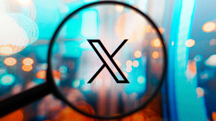 In this photo illustration, a X (Twitter) logo seen...