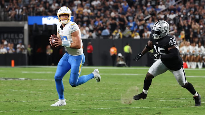 Chargers quarterback Justin Herbert (10) looks to pass against the Raiders Monday night. Chargers quarterback Justin Herbert (10) looks to pass against the Raiders Monday night.