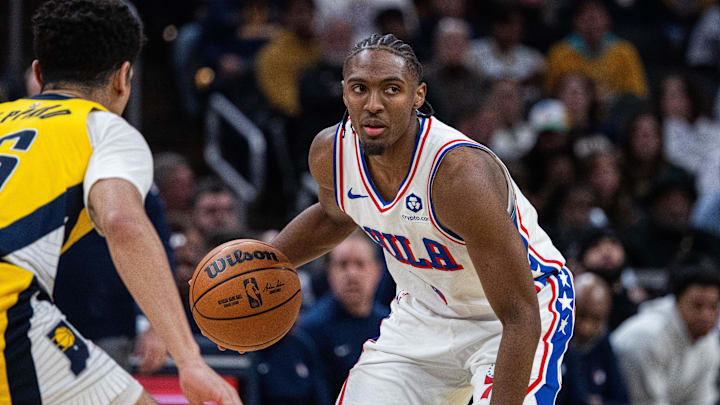 Jan 18, 2025; Indianapolis, Indiana, USA; Philadelphia 76ers guard Tyrese Maxey (0) dribbles the ball while  Indiana Pacers guard Ben Sheppard (26) defends in the second half at Gainbridge Fieldhouse. Mandatory Credit: Trevor Ruszkowski-Imagn Images
