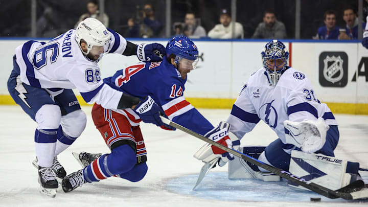 Nov 29, 2025; New York, New York, USA; Tampa Bay Lightning goaltender Jonas Johansson (31) defends the net as right wing Nikita Kucherov (86) and New York Rangers right wing Taylor Raddysh (14) battle for control of the puck in the second period at Madison Square Garden. Mandatory Credit: Wendell Cruz-Imagn Images Nov 29, 2025; New York, New York, USA; Tampa Bay Lightning goaltender Jonas Johansson (31) defends the net as right wing Nikita Kucherov (86) and New York Rangers right wing Taylor Raddysh (14) battle for control of the puck in the second period at Madison Square Garden. Mandatory Credit: Wendell Cruz-Imagn Images