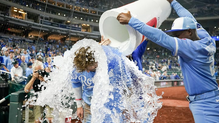 Sep 6, 2025; Kansas City, Missouri, USA; Kansas City Royals designated hitter Carter Jensen (22) is doused by second baseman Tyler Tolbert (2) and center fielder Kyle Isbel (28) after the win over the Minnesota Twins at Kauffman Stadium. Mandatory Credit: Denny Medley-Imagn Images