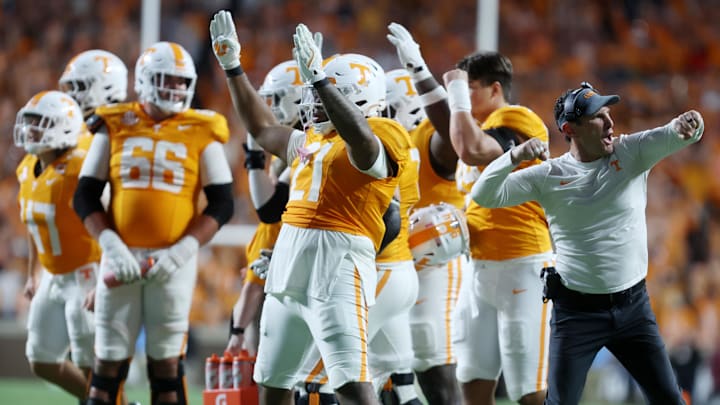 Oct 19, 2024; Knoxville, Tennessee, USA; Tennessee Volunteers players and coaches react after a play under review was ruled a touchdown against the Alabama Crimson Tide in the fourth quarter at Neyland Stadium. Mandatory Credit: Alan Poizner-Imagn Images