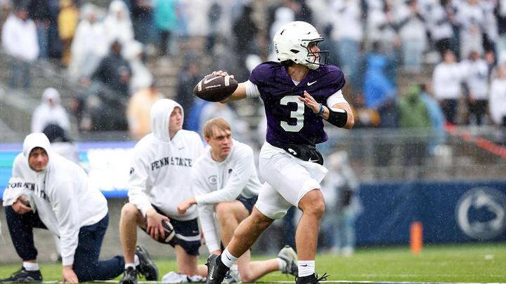 Penn State Nittany Lions quarterback Rocco Becht looks to throw a pass on the run during the Blue-White Spring game at Beaver Stadium. Penn State Nittany Lions quarterback Rocco Becht looks to throw a pass on the run during the Blue-White Spring game at Beaver Stadium.