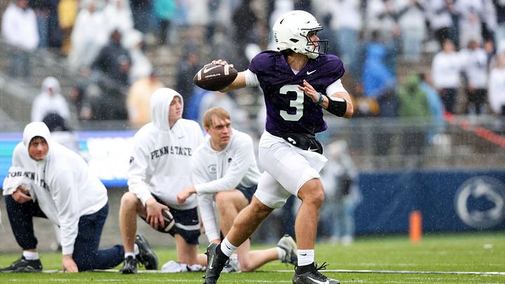Penn State Nittany Lions quarterback Rocco Becht looks to throw a pass on the run during spring practice at Beaver Stadium. Penn State Nittany Lions quarterback Rocco Becht looks to throw a pass on the run during spring practice at Beaver Stadium.