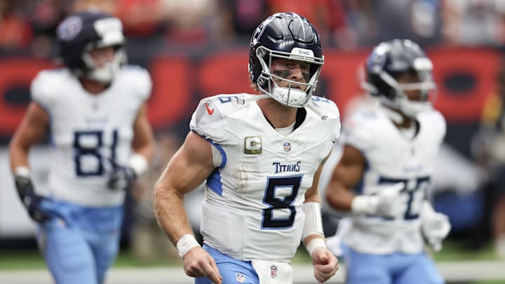 Nov 24, 2024; Houston, Texas, USA; Tennessee Titans quarterback Will Levis (8) runs off the field after throwing a touchdown pass against the Houston Texans in the first quarter at NRG Stadium.