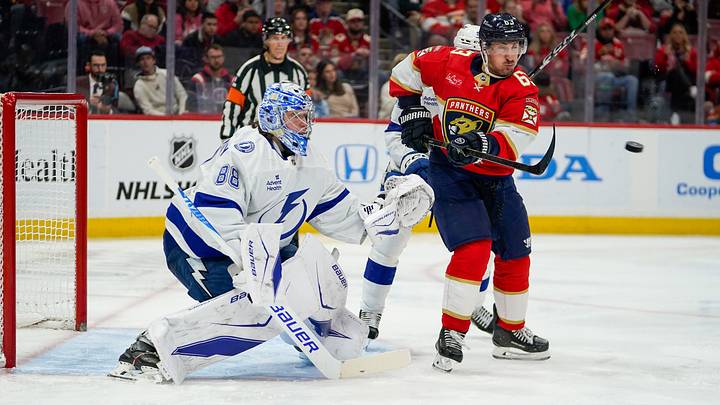 Dec 27, 2025; Sunrise, Florida, USA; Florida Panthers left wing Brad Marchand (63) attempts to deflect a puck past Tampa Bay Lightning goaltender Andrei Vasilevskiy (88) during the third period at Amerant Bank Arena. Mandatory Credit: Jeff Romance-Imagn Images Dec 27, 2025; Sunrise, Florida, USA; Florida Panthers left wing Brad Marchand (63) attempts to deflect a puck past Tampa Bay Lightning goaltender Andrei Vasilevskiy (88) during the third period at Amerant Bank Arena. Mandatory Credit: Jeff Romance-Imagn Images