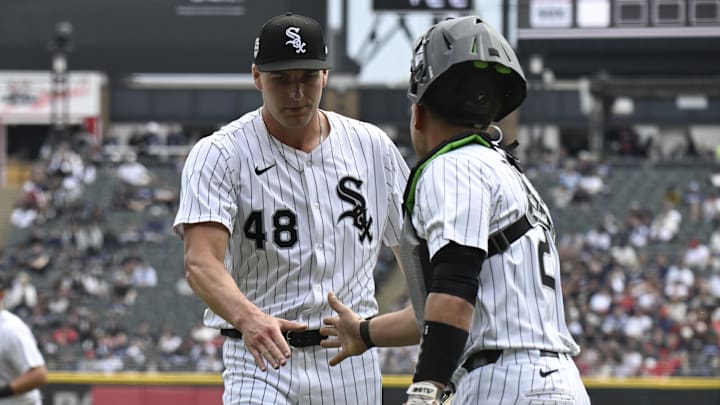 Chicago White Sox pitcher Jonathan Cannon (48) high fives catcher Matt Thaiss (29) against the Los Angeles Angels at Rate Field. Chicago White Sox pitcher Jonathan Cannon (48) high fives catcher Matt Thaiss (29) against the Los Angeles Angels at Rate Field.