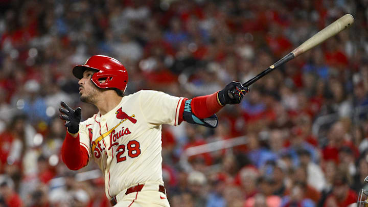 Sep 20, 2025; St. Louis, Missouri, USA; St. Louis Cardinals third baseman Nolan Arenado (28) hits a one run single against the Milwaukee Brewers during the fourth inning at Busch Stadium. Mandatory Credit: Jeff Curry-Imagn Images