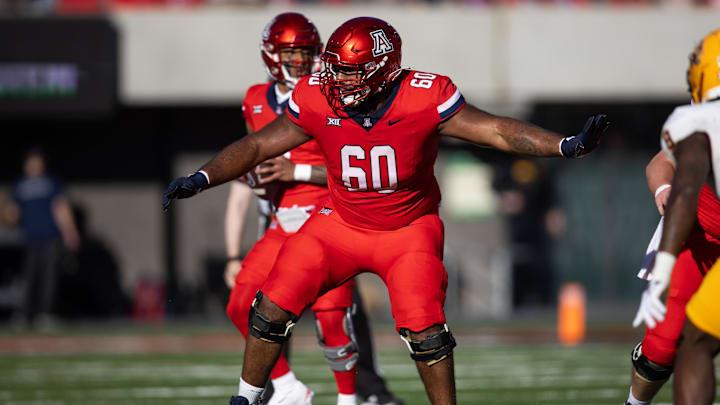 Nov 30, 2024; Tucson, Arizona, USA; Arizona Wildcats offensive lineman Alexander Doost (60) against the Arizona State Sun Devils during the Territorial Cup at Arizona Stadium. Mandatory Credit: Mark J. Rebilas-Imagn Images