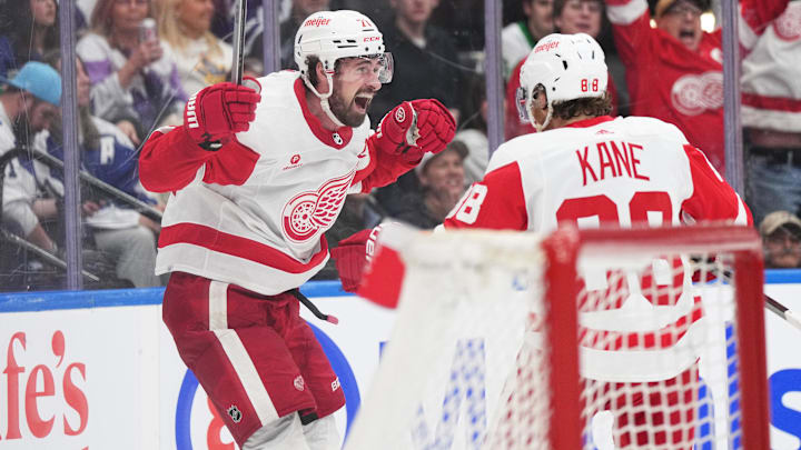 Apr 13, 2024; Toronto, Ontario, CAN; Detroit Red Wings center Dylan Larkin (71) scores the winning goal and celebrates with right wing Patrick Kane (88) against the Toronto Maple Leafs during the overtime period at Scotiabank Arena. Mandatory Credit: Nick Turchiaro-USA TODAY Sports