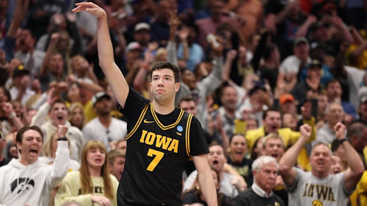 Mar 22, 2026; Tampa, FL, USA; Iowa Hawkeyes forward Alvaro Folgueiras (7) makes a go-ahead three-point basket against the Florida Gators late in the second half during a second round game of the men's 2026 NCAA Tournament at Benchmark International Arena. Mandatory Credit: Nathan Ray Seebeck-Imagn Images