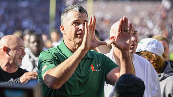 Dec 20, 2025; College Station, TX, USA; Miami Hurricanes head coach Mario Cristobal celebrates as he walks off the field after the Hurricanes win over the Texas A&M Aggies at Kyle Field. Mandatory Credit: Jerome Miron-Imagn Images Dec 20, 2025; College Station, TX, USA; Miami Hurricanes head coach Mario Cristobal celebrates as he walks off the field after the Hurricanes win over the Texas A&M Aggies at Kyle Field. Mandatory Credit: Jerome Miron-Imagn Images