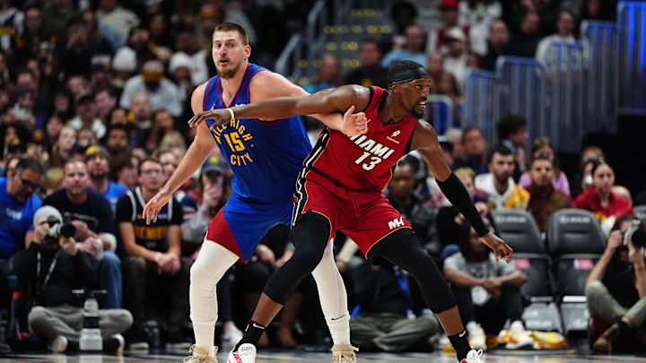 Nov 8, 2024; Denver, Colorado, USA; Miami Heat center Bam Adebayo (13) and Denver Nuggets center Nikola Jokic (15) battle for position on the court in the second half at Ball Arena. Mandatory Credit: Ron Chenoy-Imagn Images Nov 8, 2024; Denver, Colorado, USA; Miami Heat center Bam Adebayo (13) and Denver Nuggets center Nikola Jokic (15) battle for position on the court in the second half at Ball Arena. Mandatory Credit: Ron Chenoy-Imagn Images