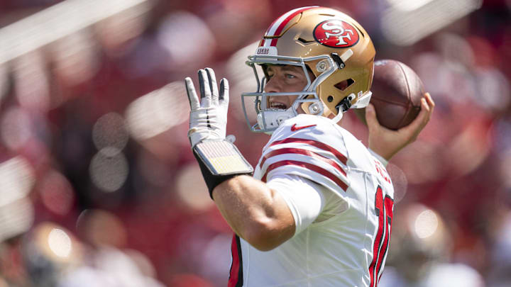 Sep 21, 2025; Santa Clara, California, USA; San Francisco 49ers quarterback Mac Jones (10) warms up prior to a game against the Arizona Cardinals at Levi's Stadium. Mandatory Credit: Cary Edmondson-Imagn Images