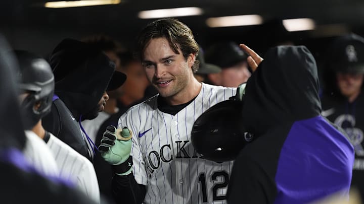 Sep 16, 2025; Denver, Colorado, USA; Colorado Rockies third baseman Kyle Karros (12) celebrates scoring a run in the eighth inning against the Miami Marlins at Coors Field. 