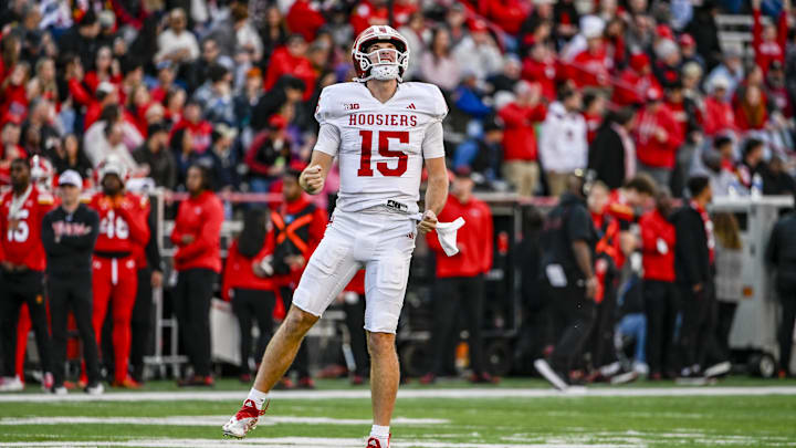 Nov 1, 2025; College Park, Maryland, USA;  Indiana Hoosiers quarterback Fernando Mendoza (15) celebrates after throwing a touchdown during the second quarter against the Maryland Terrapins at SECU Stadium. Mandatory Credit: Tommy Gilligan-Imagn Images