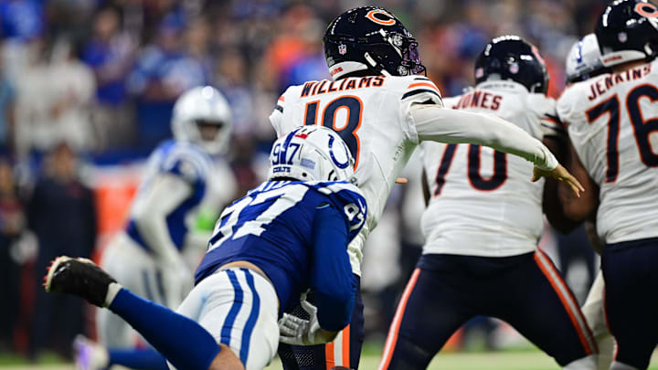 Defensive end Laiatu Latu knocks the ball away from Bears quarterback Caleb Williams for a critical stip-sack Sunday.