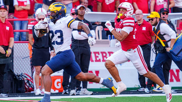  Michigan Wolverines running back Jordan Marshall runs for a touchdown against Nebraska Cornhuskers defensive back Donovan Jones during the third quarter.