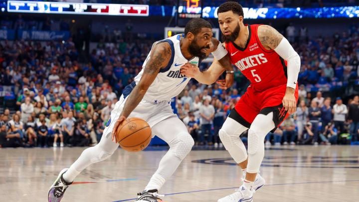 Apr 7, 2024; Dallas, Texas, USA; Dallas Mavericks guard Kyrie Irving (11) drives around Houston
