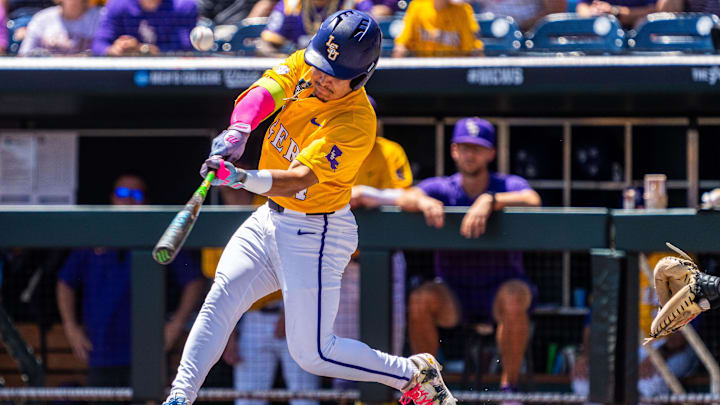 Jun 22, 2025; Omaha, Neb, USA; LSU Tigers shortstop Steven Milam (4) hits a single against the Coastal Carolina Chanticleers during the first inning at Charles Schwab Field. Mandatory Credit: Dylan Widger-Imagn Images