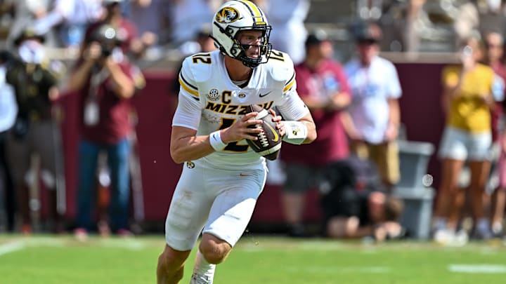 Oct 5, 2024; College Station, Texas, USA; Missouri Tigers quarterback Brady Cook (12) throws a pass in the first half against the Texas A&M Aggies at Kyle Field. Mandatory Credit: Maria Lysaker-Imagn Images. 