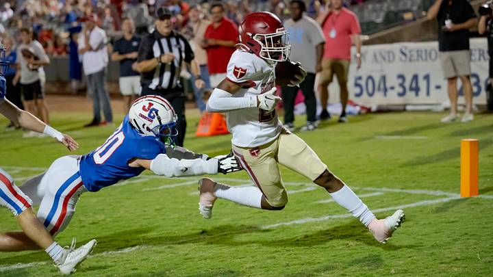 Oct 27, 2023; Metairie, LA, USA; Brother Martin Crusaders wide receiver Easton Royal (23) scores a touchdown against John Curtis Patriots linebacker Benjamin Barron (30) during the first quarter at The Shrine on Airline. Mandatory Credit: Matthew Hinton-USA TODAY Sports Oct 27, 2023; Metairie, LA, USA; Brother Martin Crusaders wide receiver Easton Royal (23) scores a touchdown against John Curtis Patriots linebacker Benjamin Barron (30) during the first quarter at The Shrine on Airline. Mandatory Credit: Matthew Hinton-USA TODAY Sports